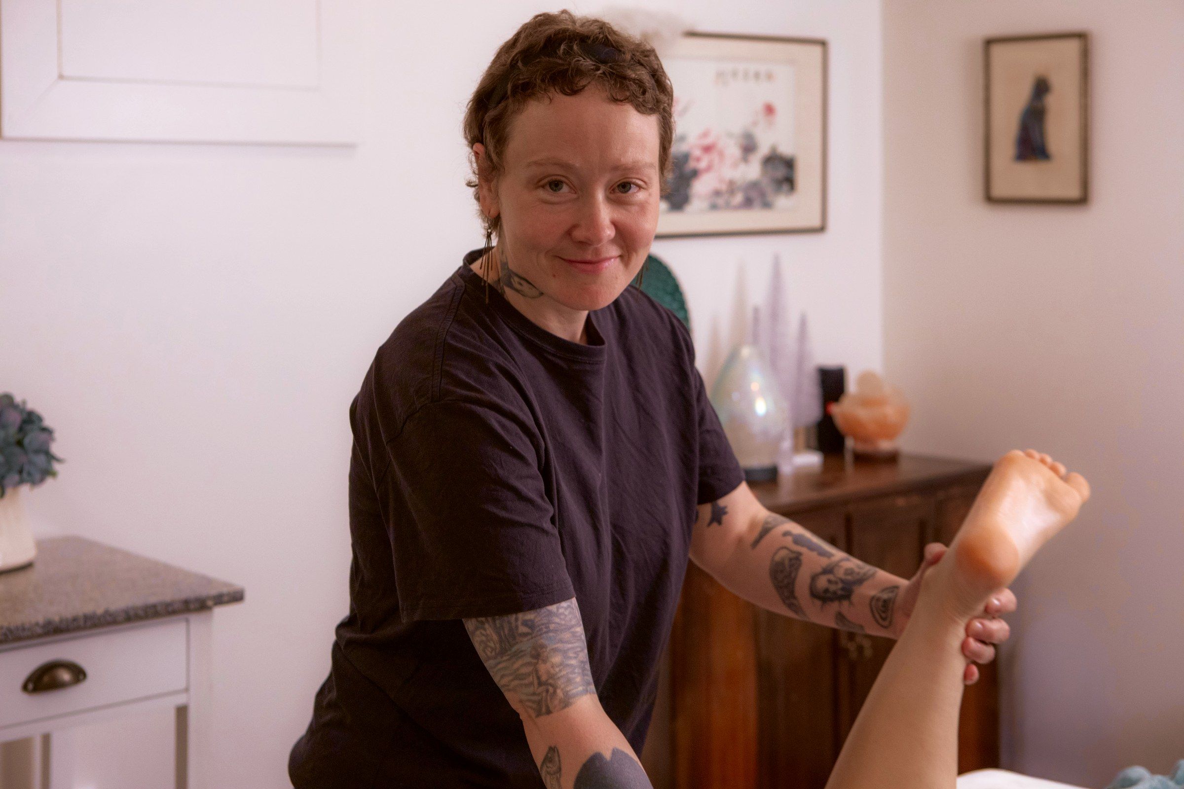 Nicole working a client's foot