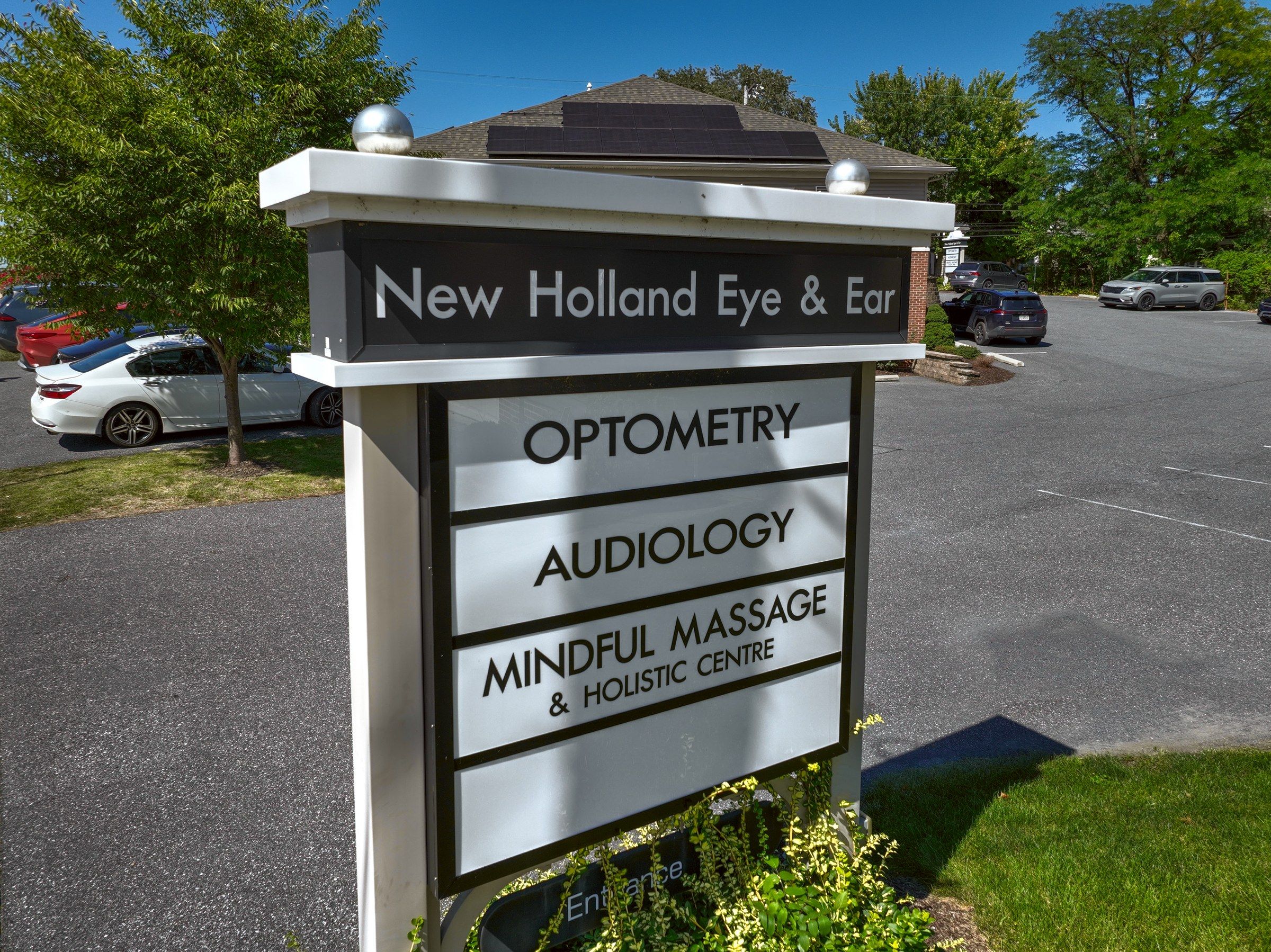 The New Holland Eye & Ear sign listing Mindful Massage & Holistic Centre
